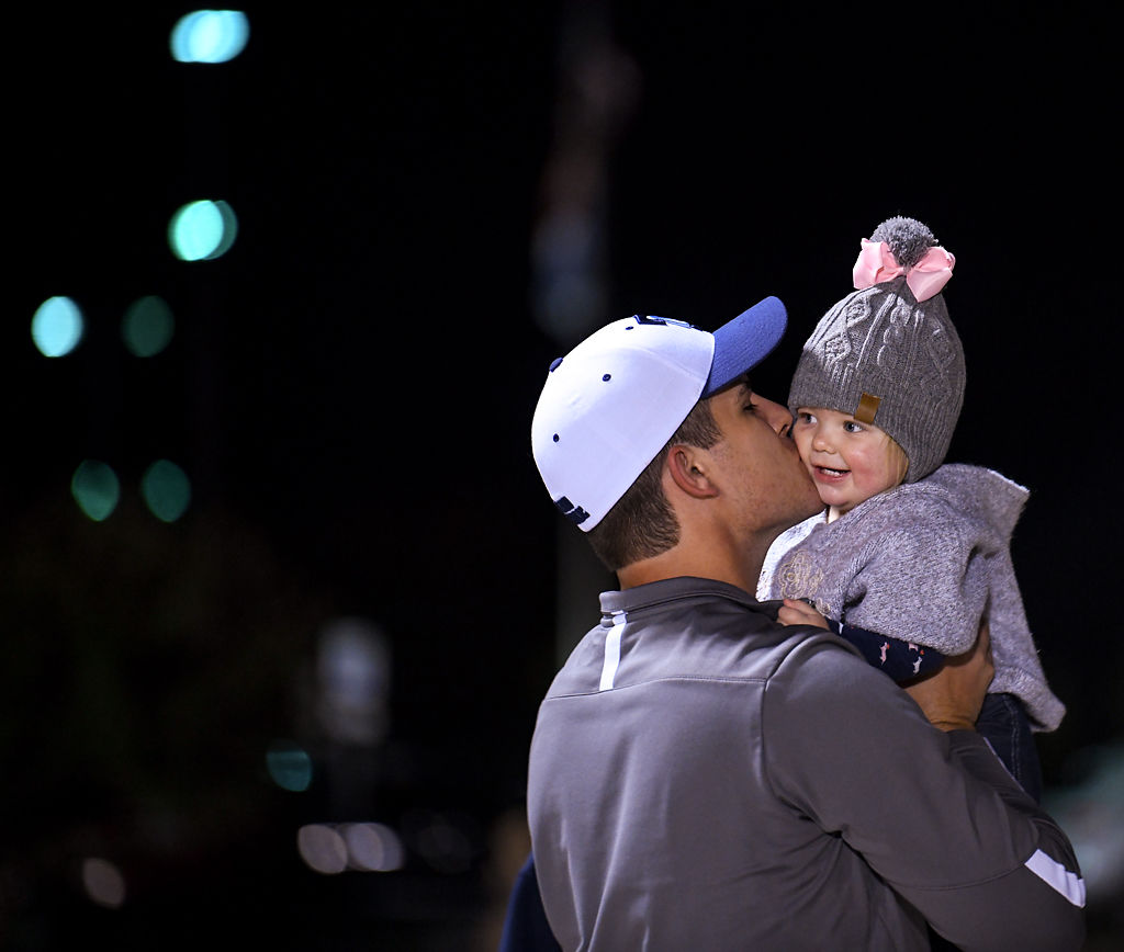 Wes Hamilton kisses his daughter